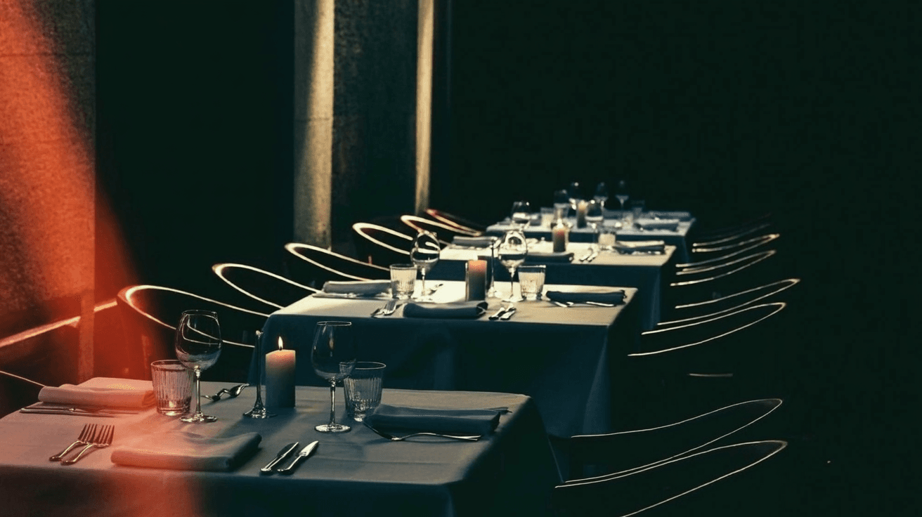 A luxury dining room set for service, anticipation in warm light